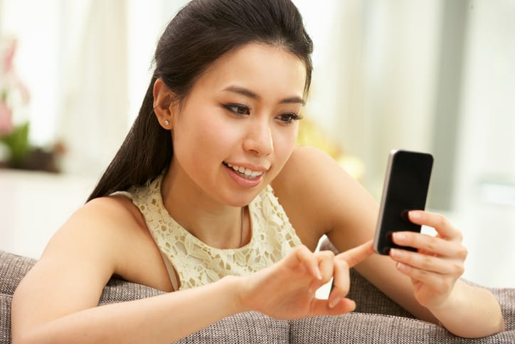 This is a photo of a young woman on her cellphone to represent mobile marketing